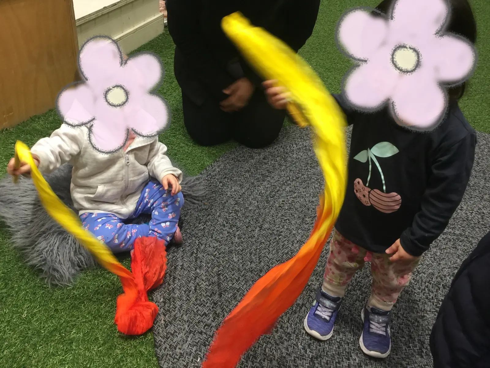 Children twirling silk ribbons